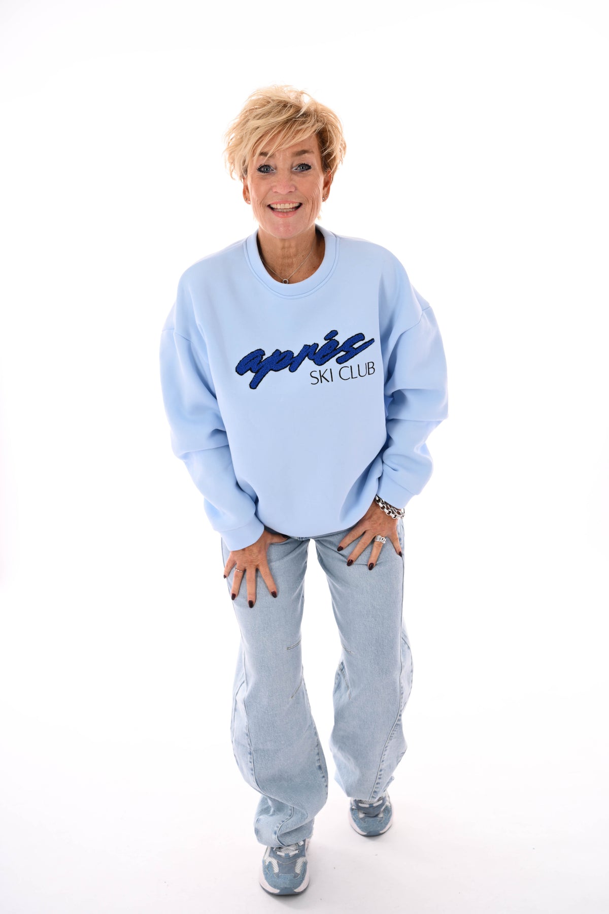 Sweater apres skiclub lichtblauw