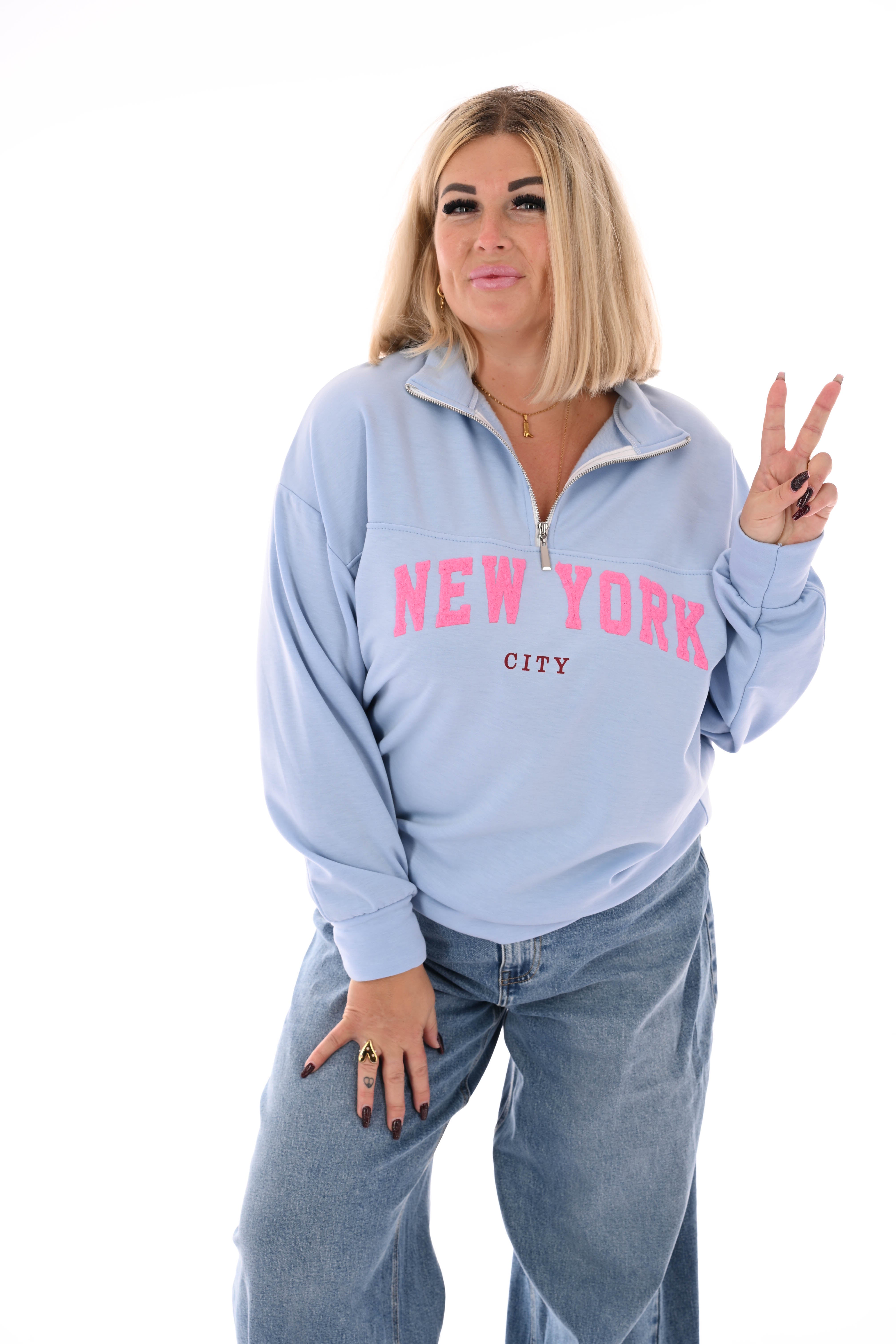 Sweater new york met rits lichtblauw