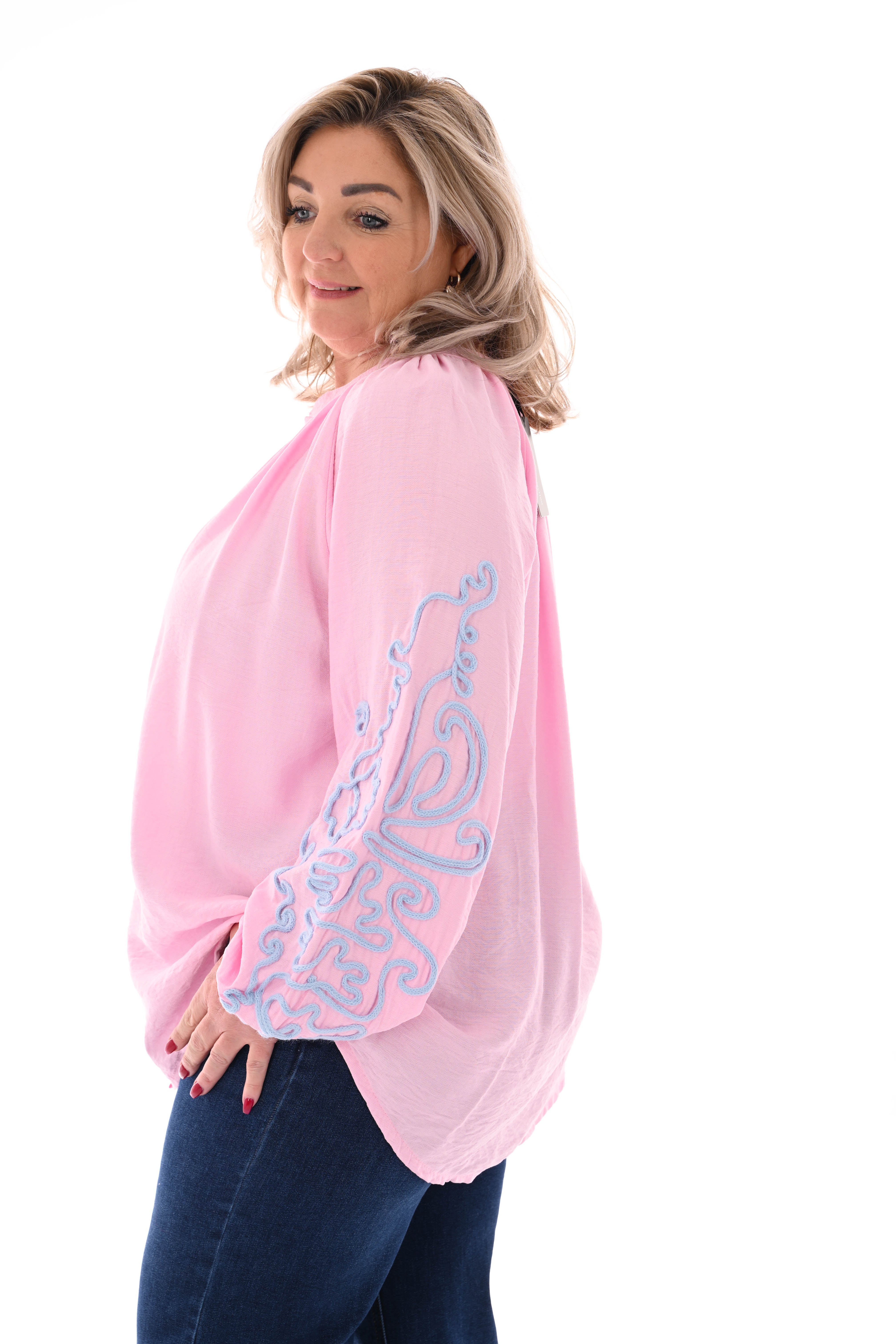 Blouse mouwen met borduursels roze