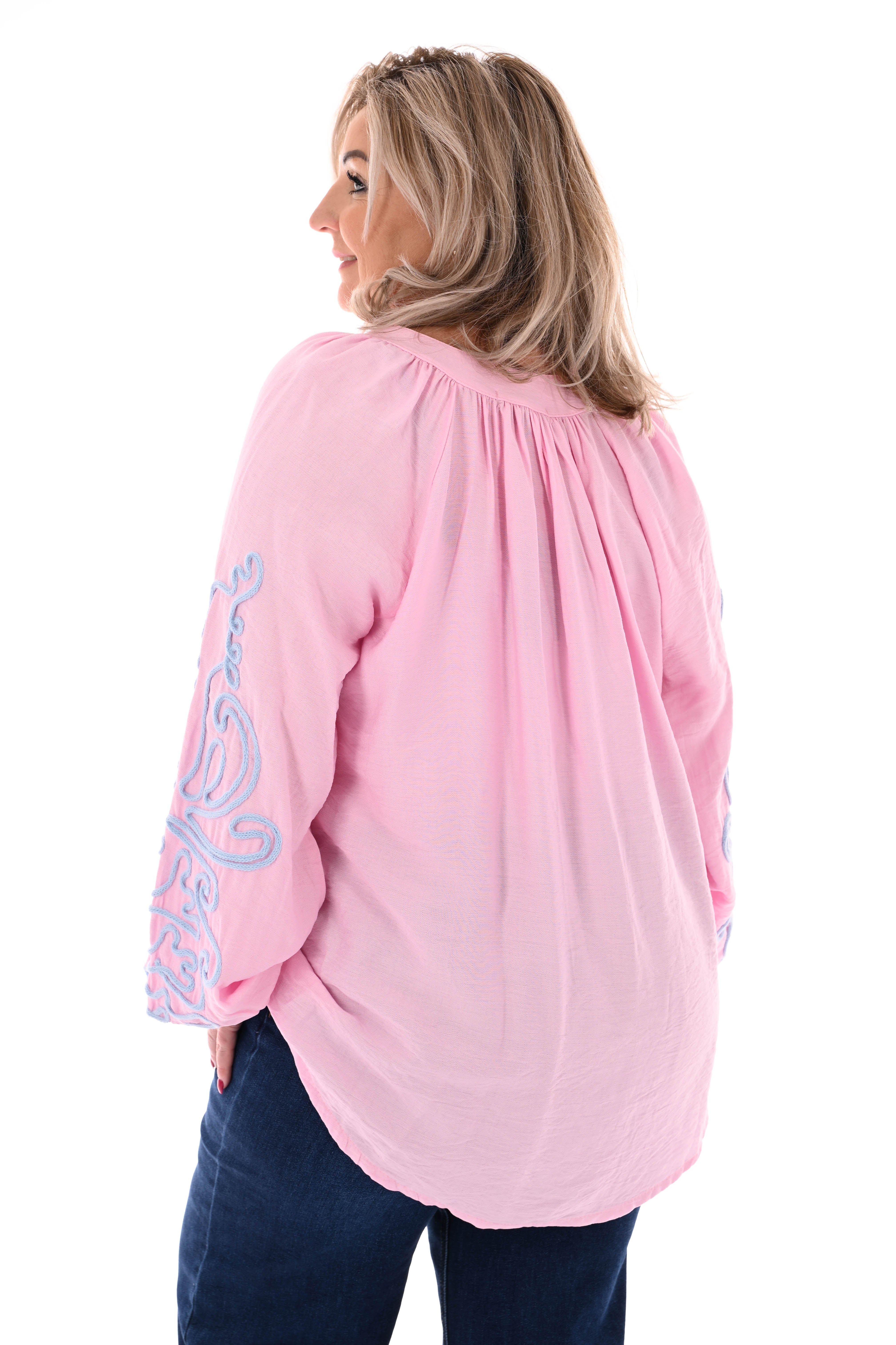 Blouse mouwen met borduursels roze