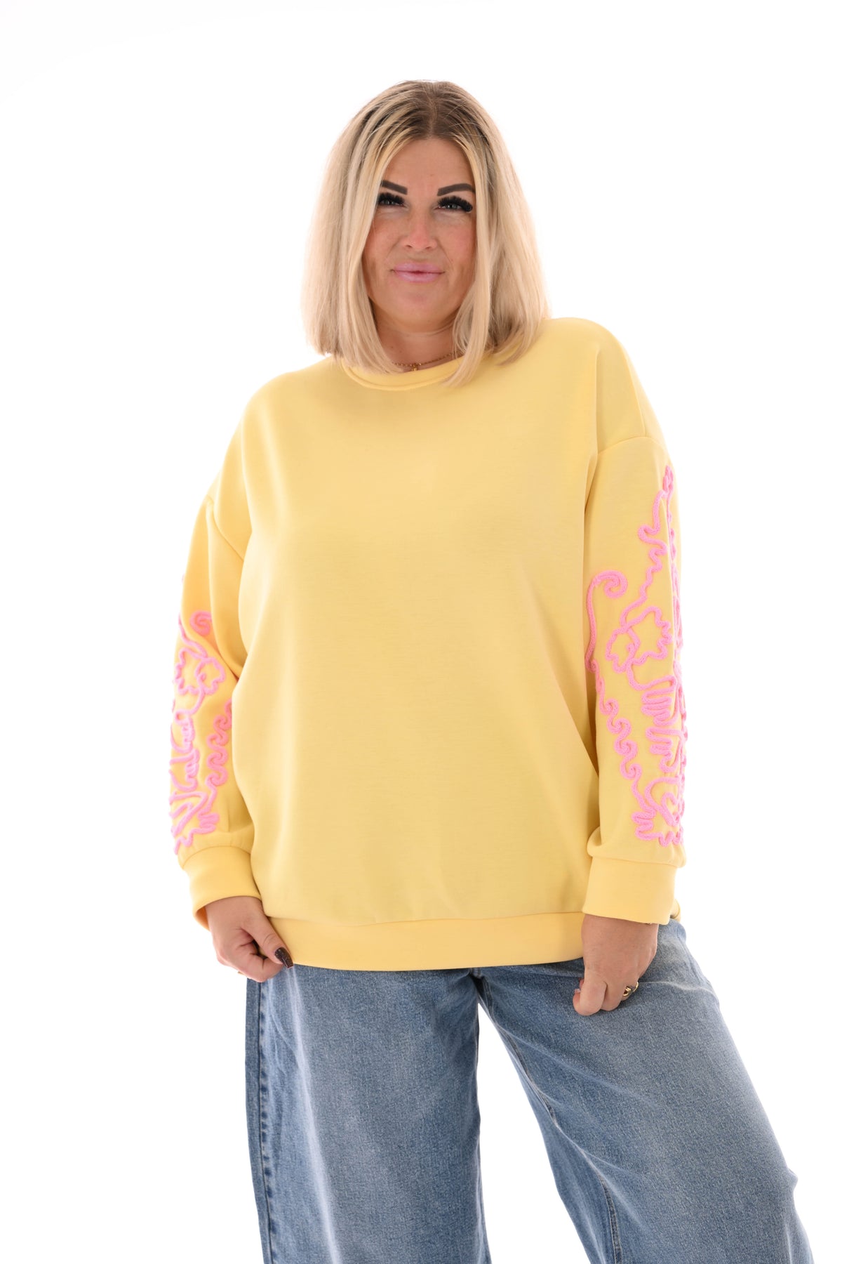 Sweater mouwen met borduursels geel