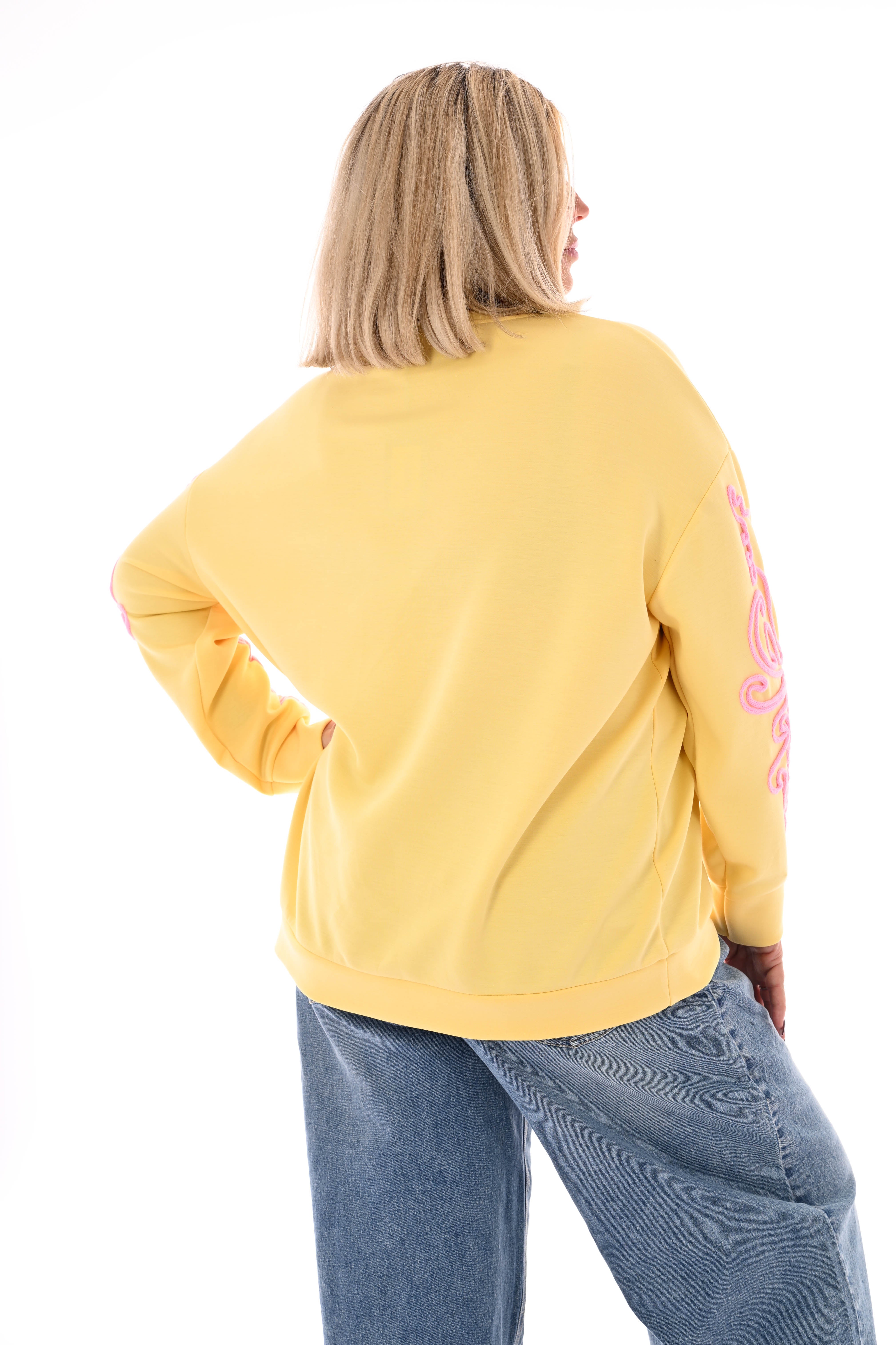 Sweater mouwen met borduursels geel