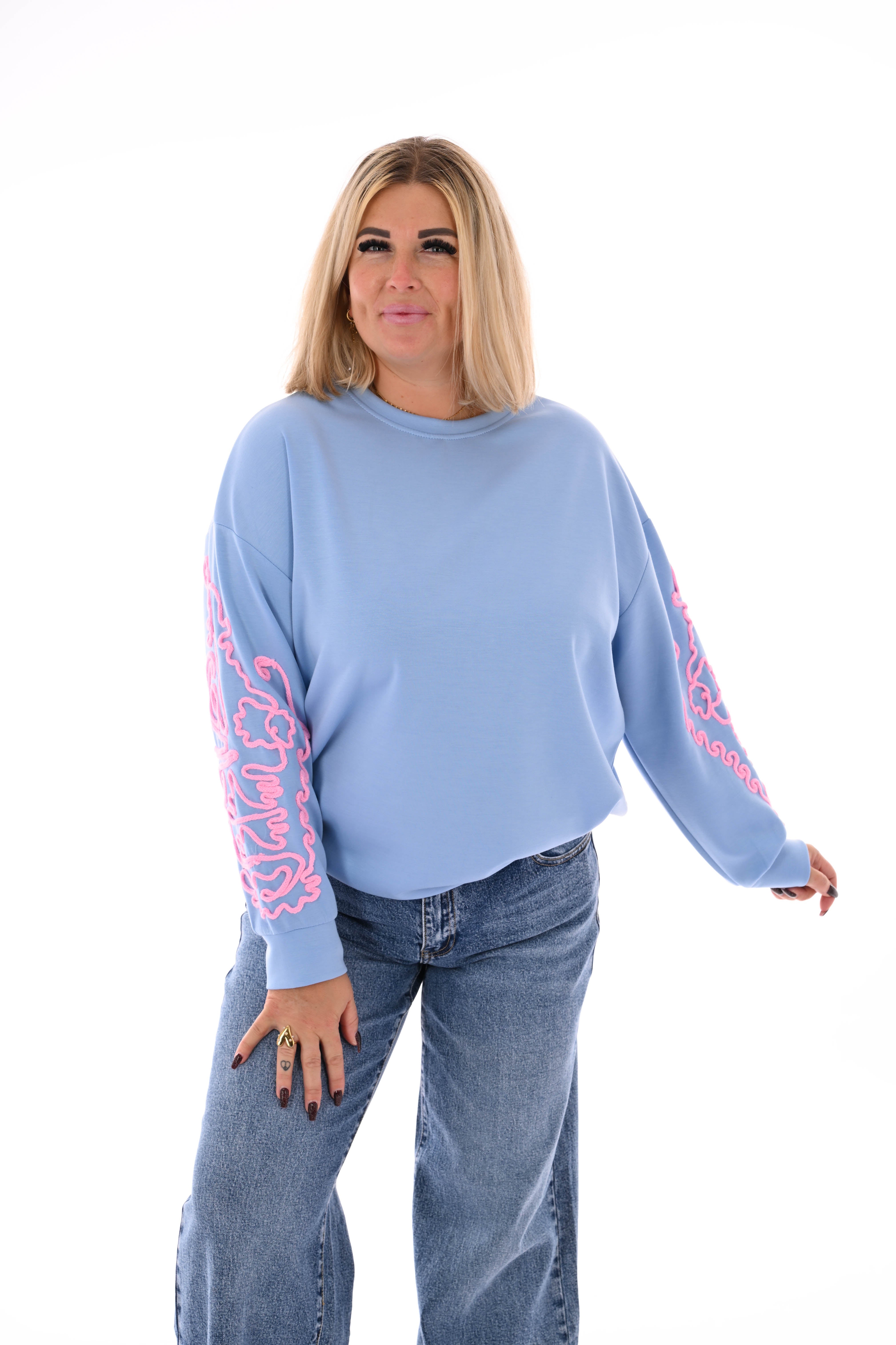 Sweater mouwen met borduursels blauw