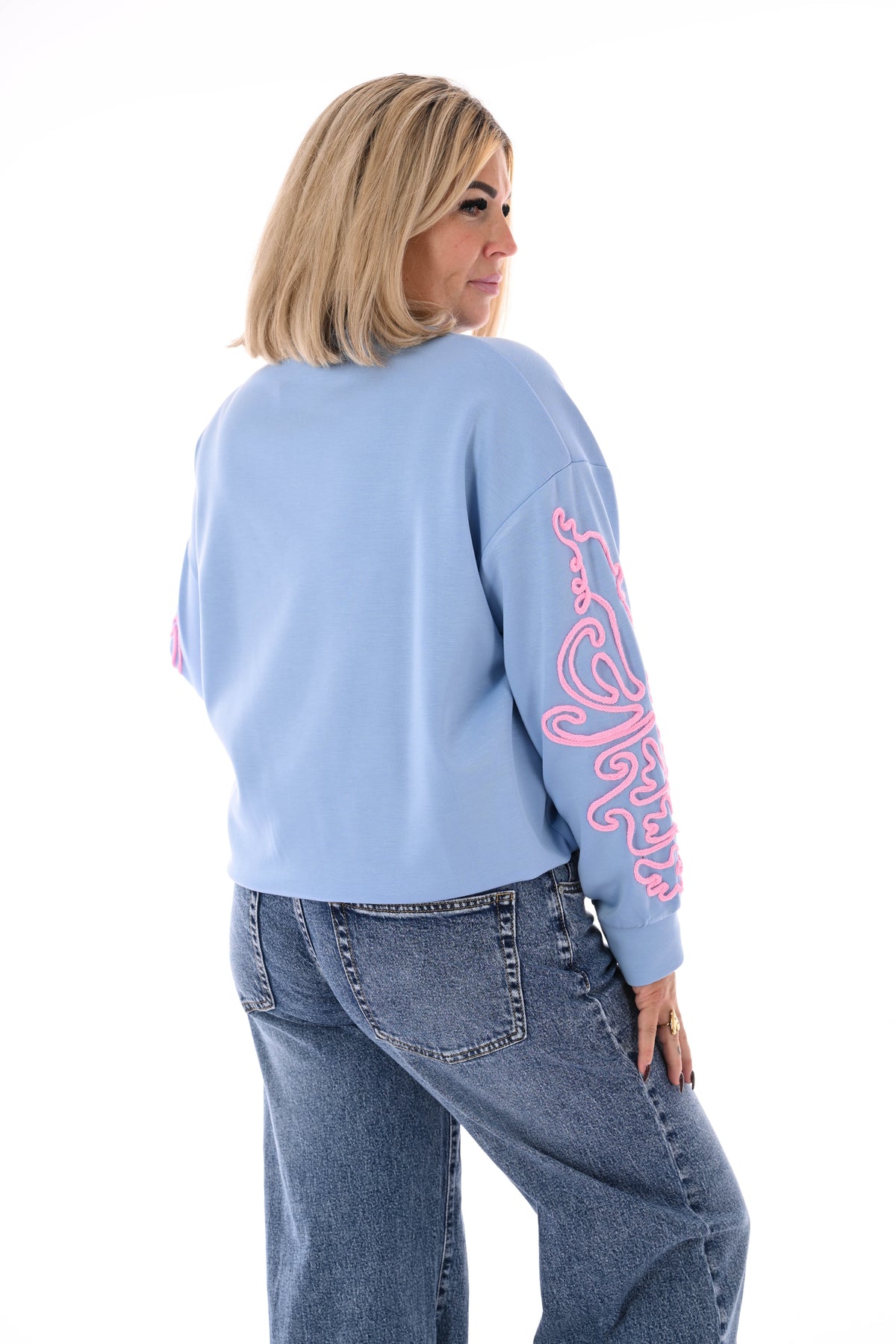 Sweater mouwen met borduursels blauw