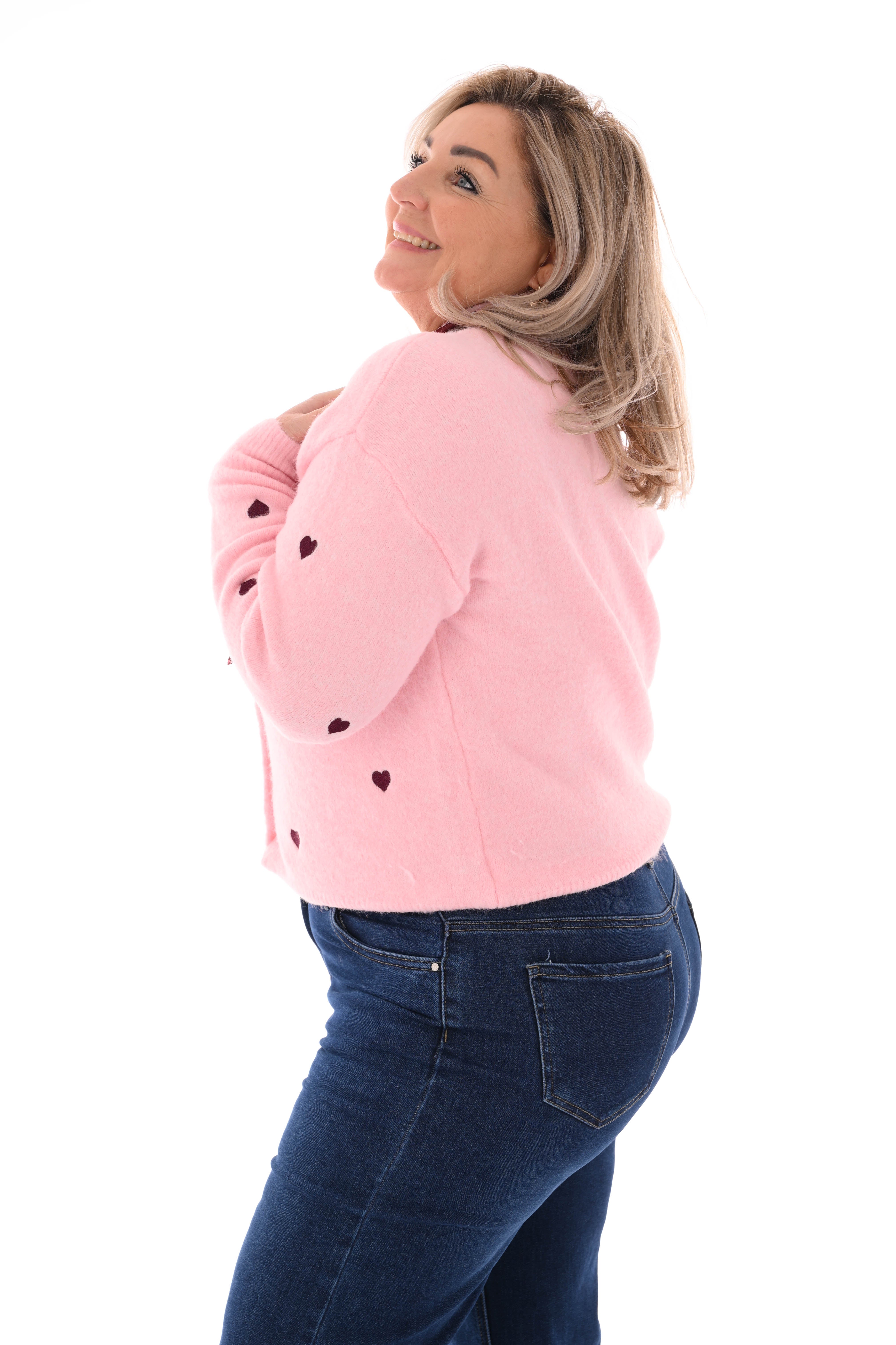 Fijn gebreid vest met hartjes roze