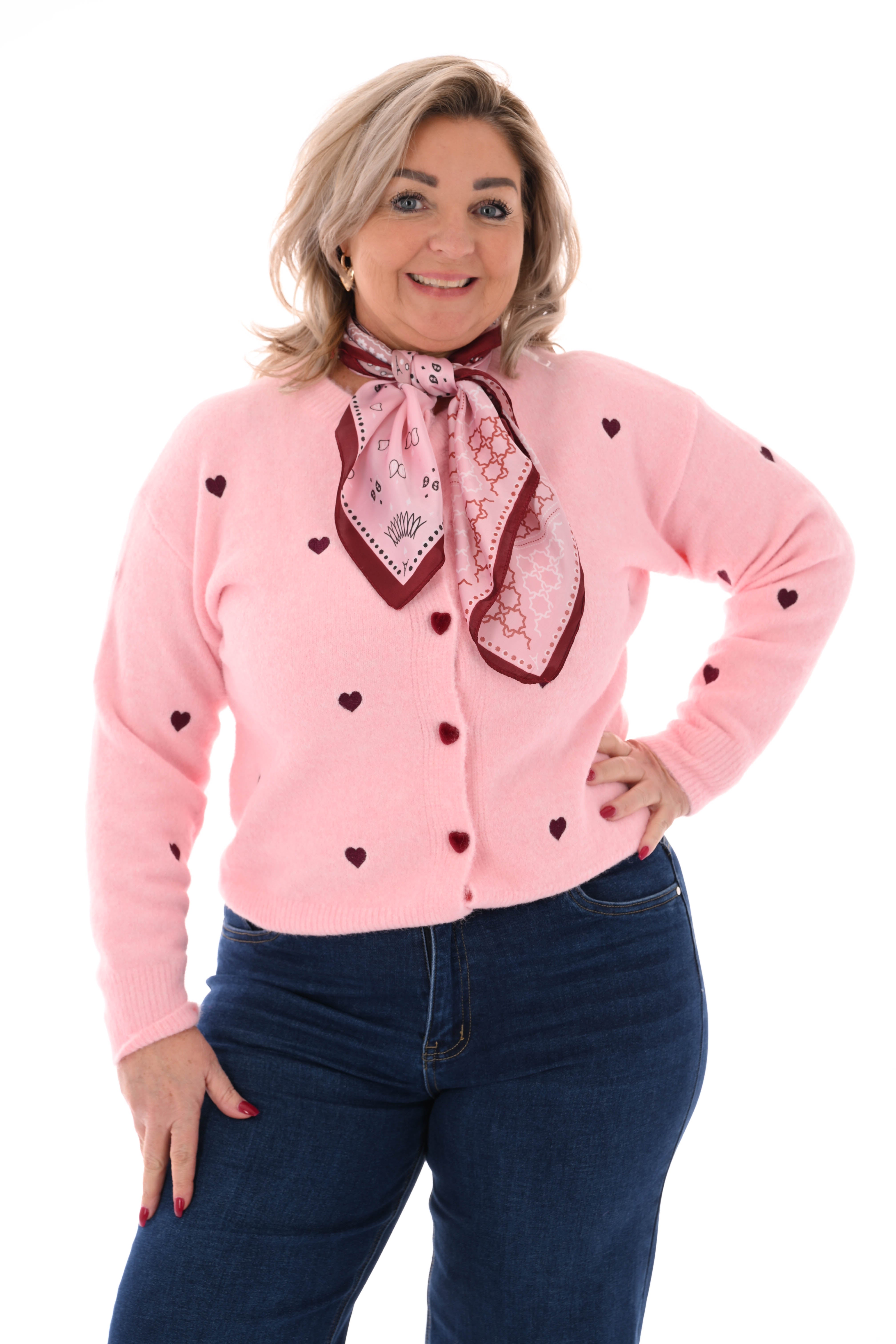 Fijn gebreid vest met hartjes roze