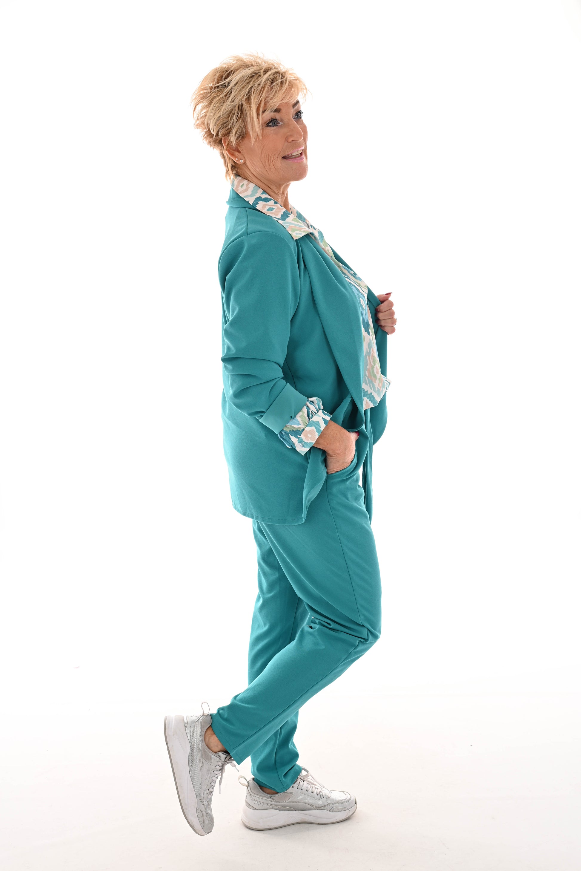 Tweedelig stretchpak met strik turquoise