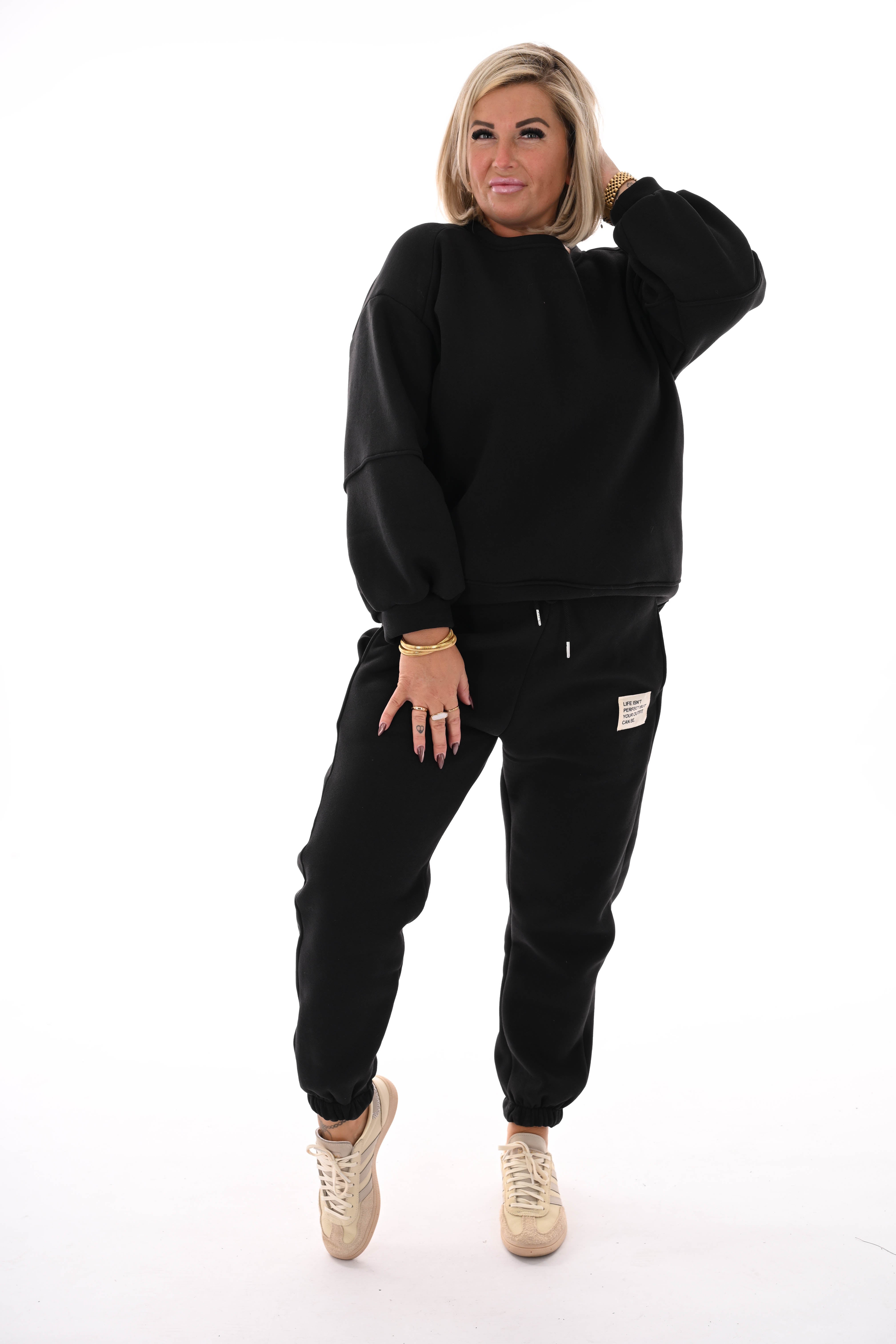 Tweedelig joggingspak applicatie zwart