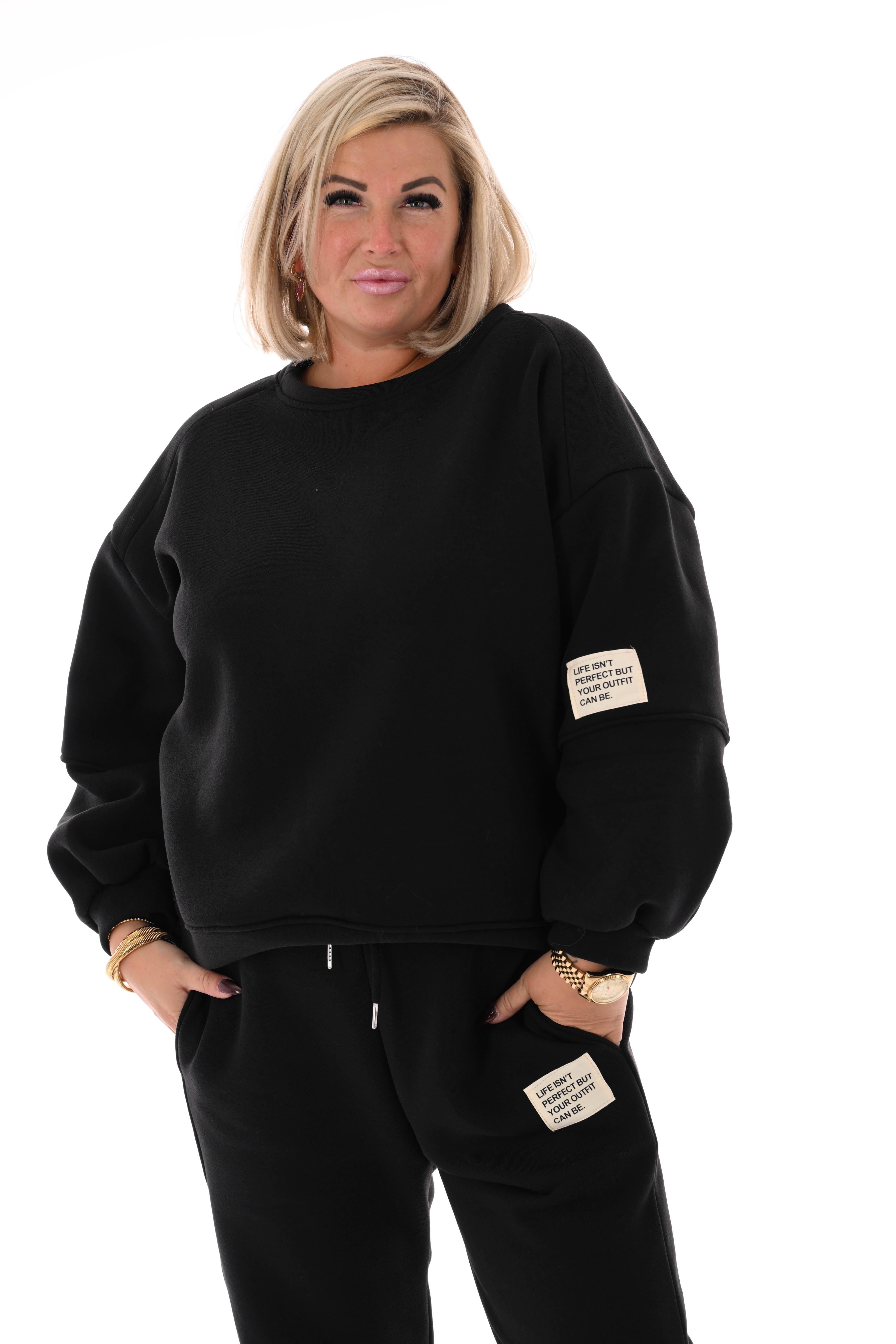 Tweedelig joggingspak applicatie zwart