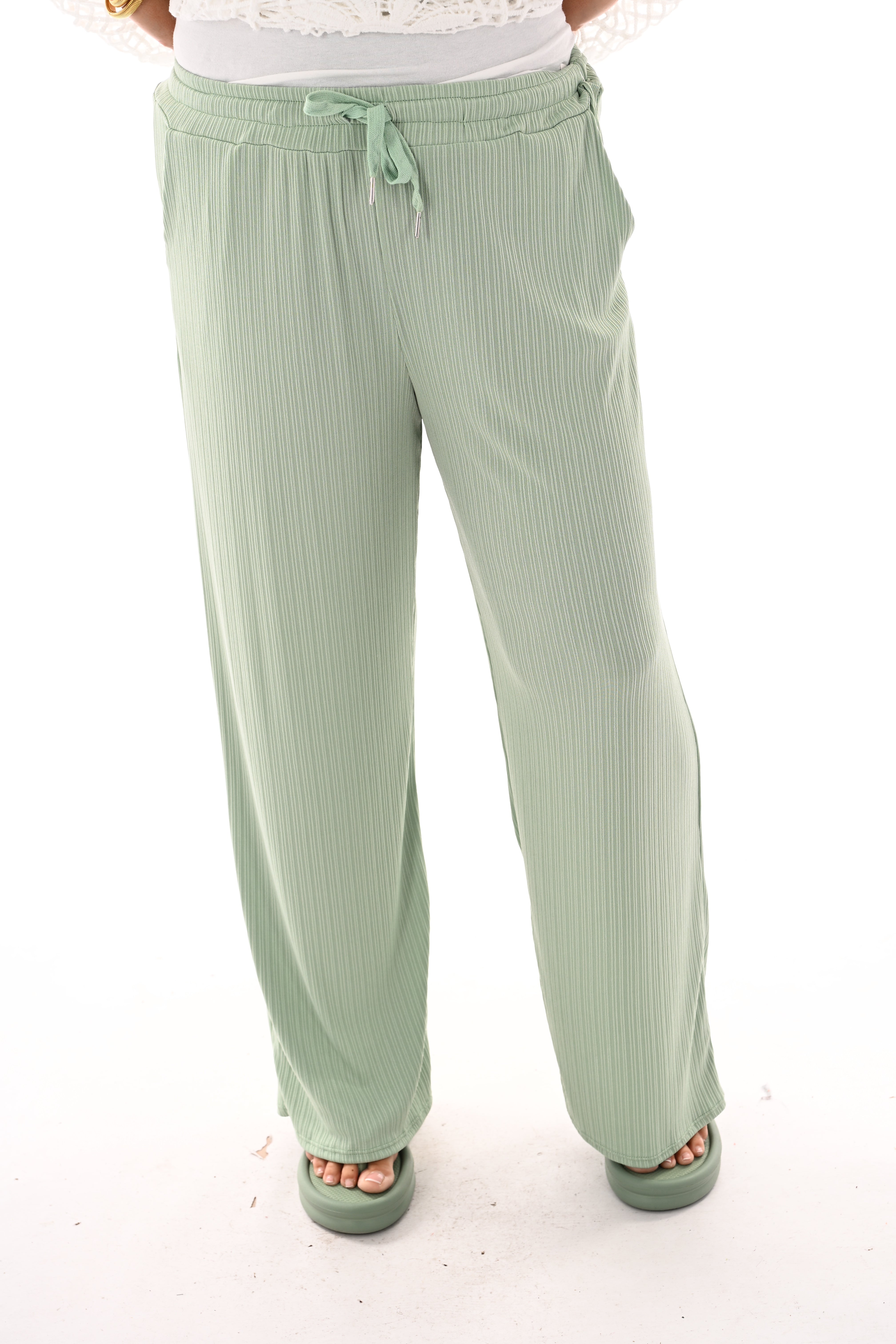 Broek smalle plooien lindegroen