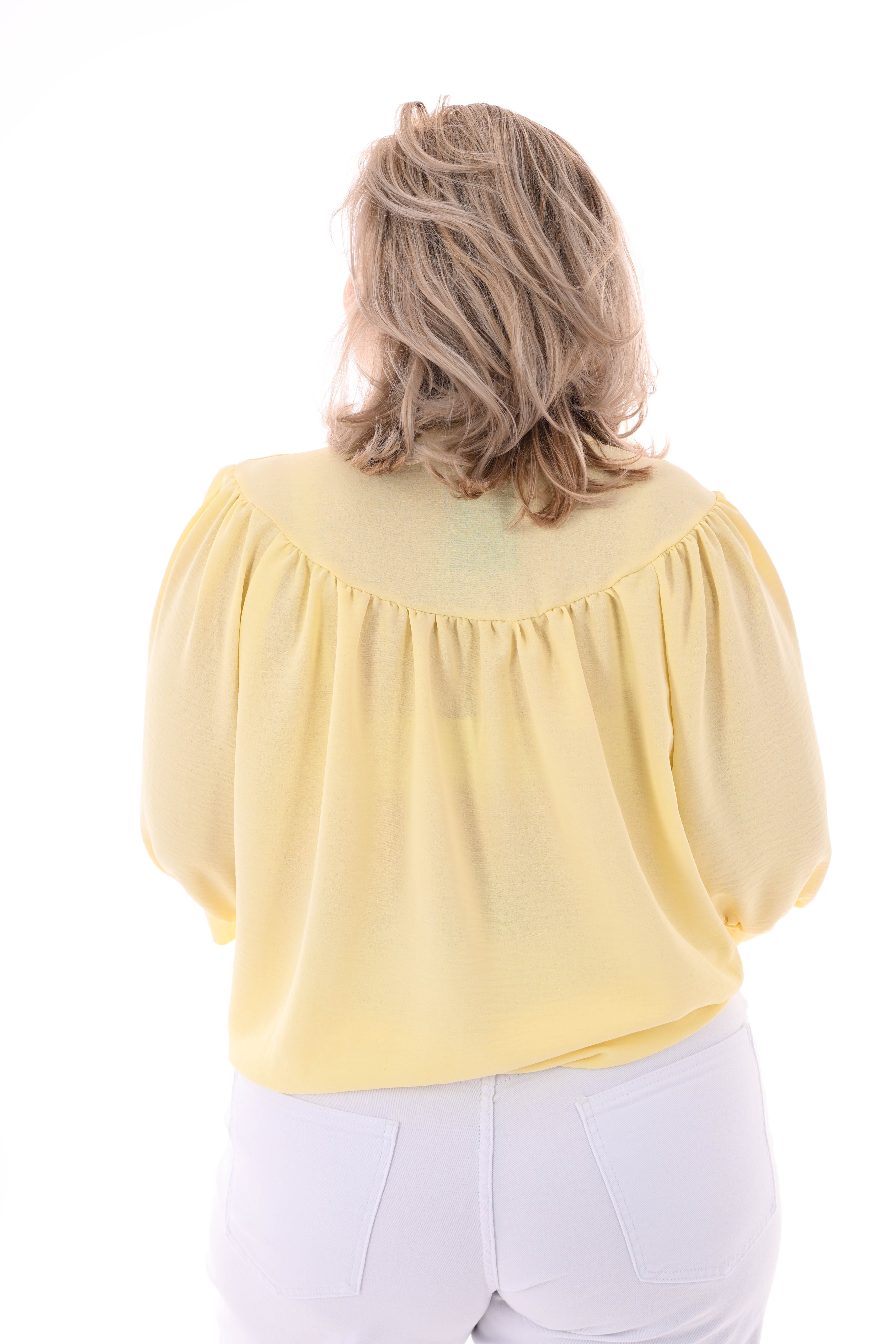 Doorknoop blouse korte pofmouwen uni botergeel
