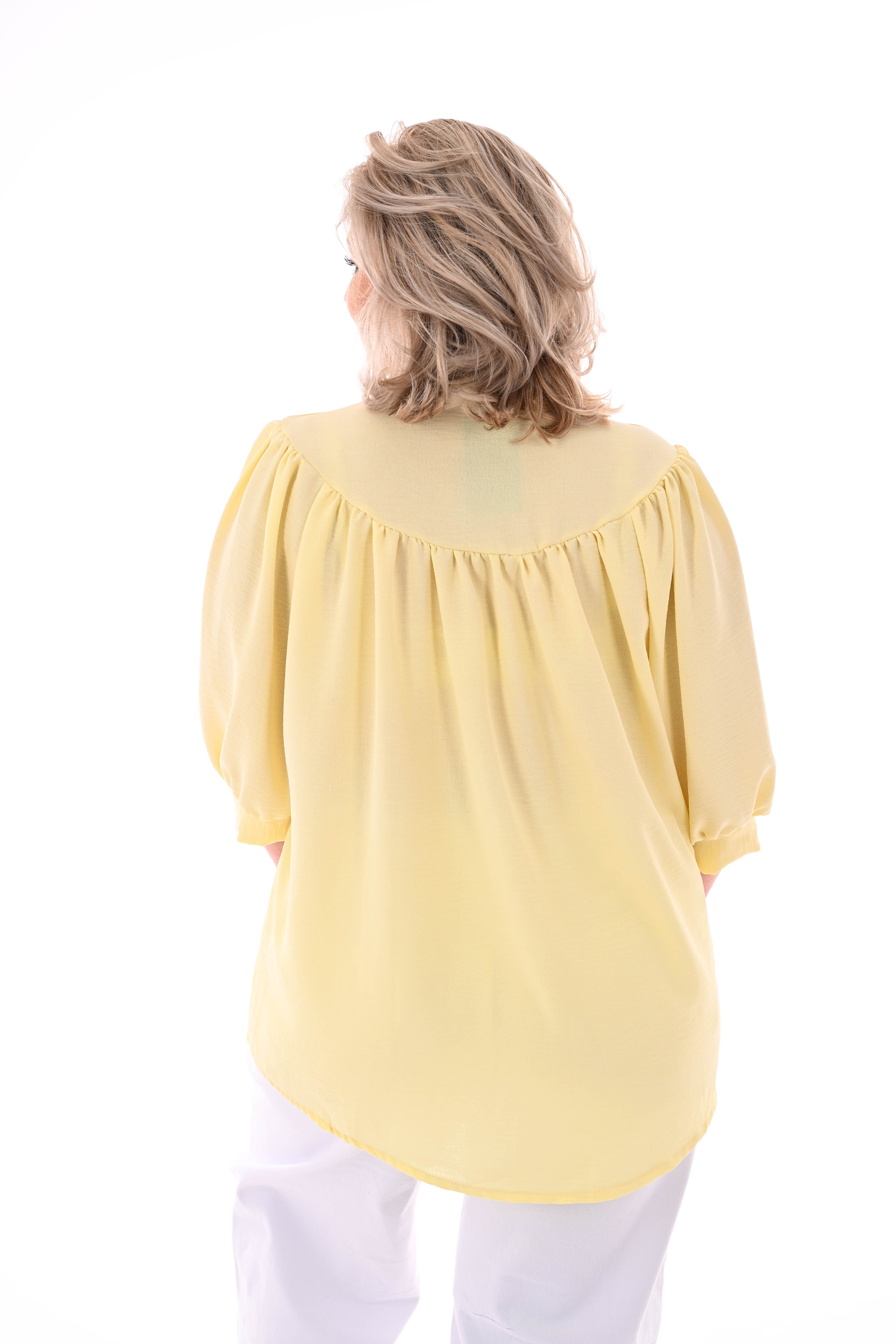 Doorknoop blouse korte pofmouwen uni botergeel