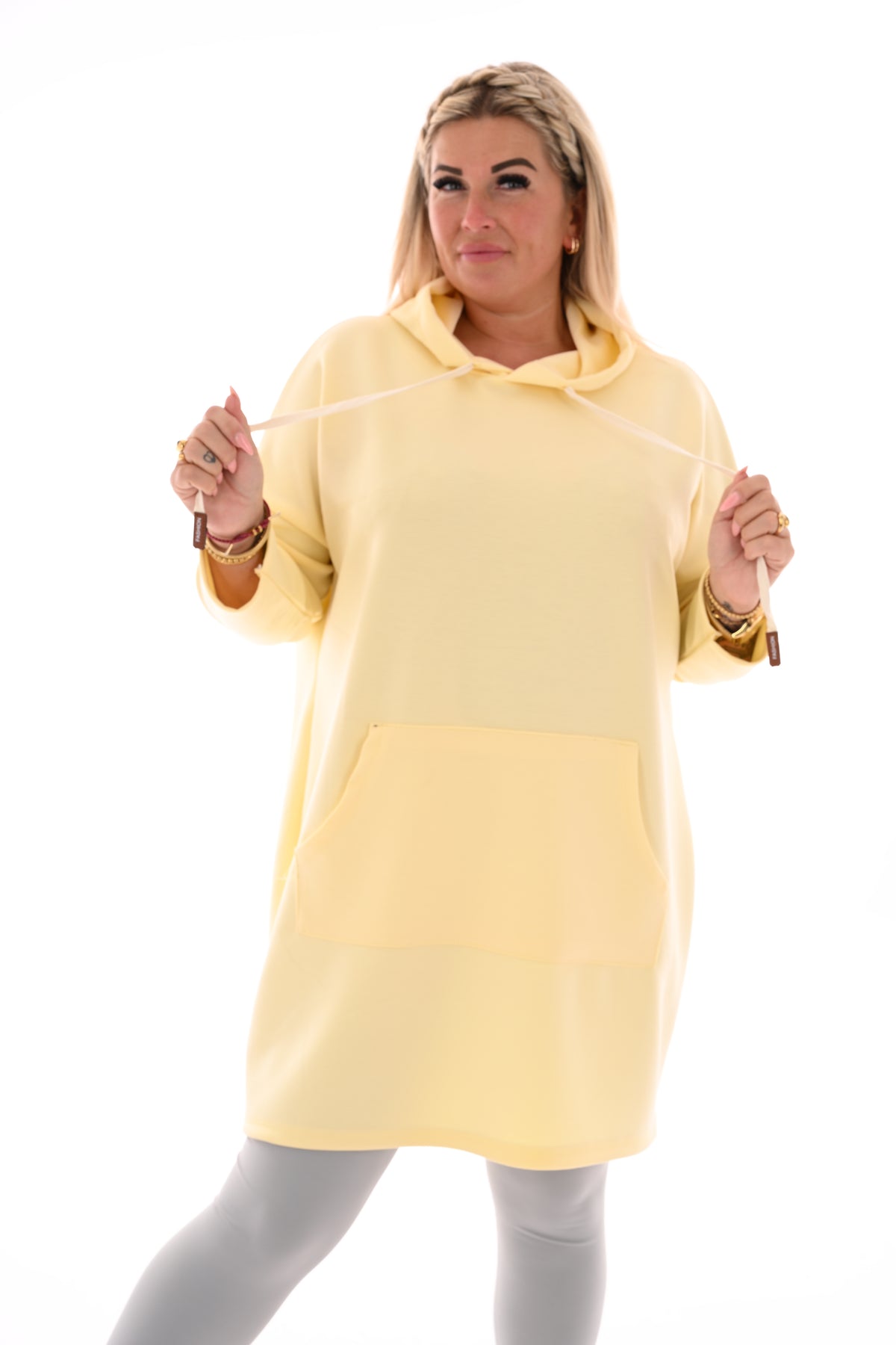 Lange sweater met chapuchon lichtgeel
