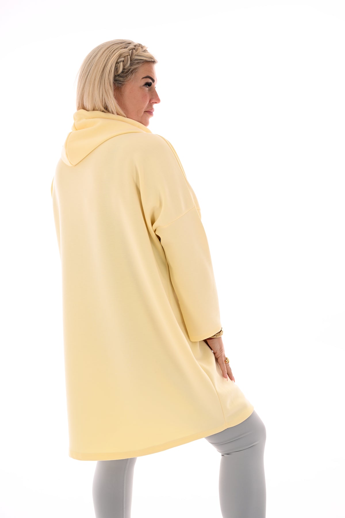Lange sweater met chapuchon lichtgeel