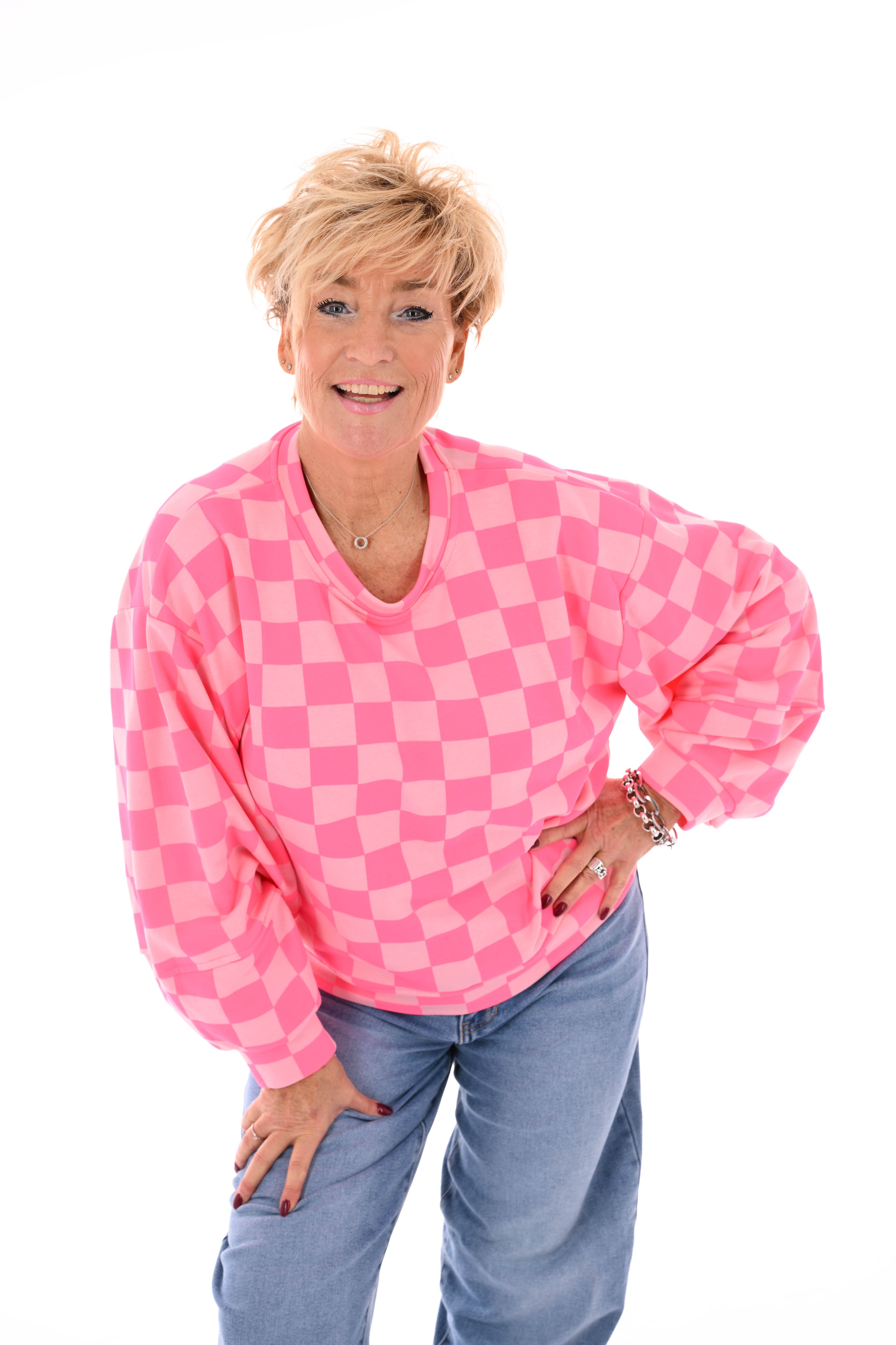 Geblokte sweater lichtroze/felroze