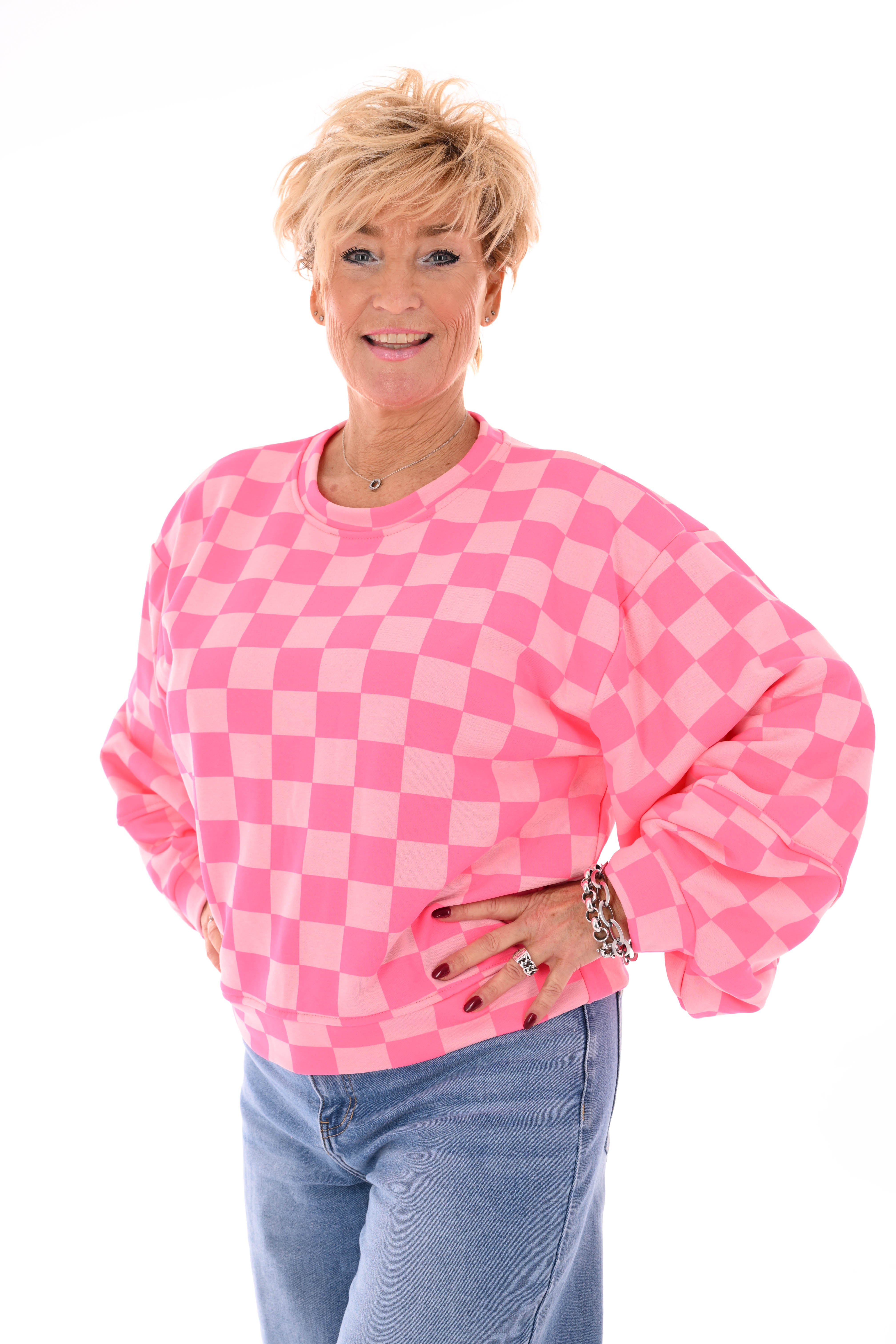 Geblokte sweater lichtroze/felroze