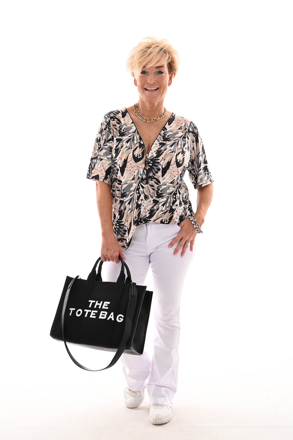 Travel top met rits bladeren zwart/beige
