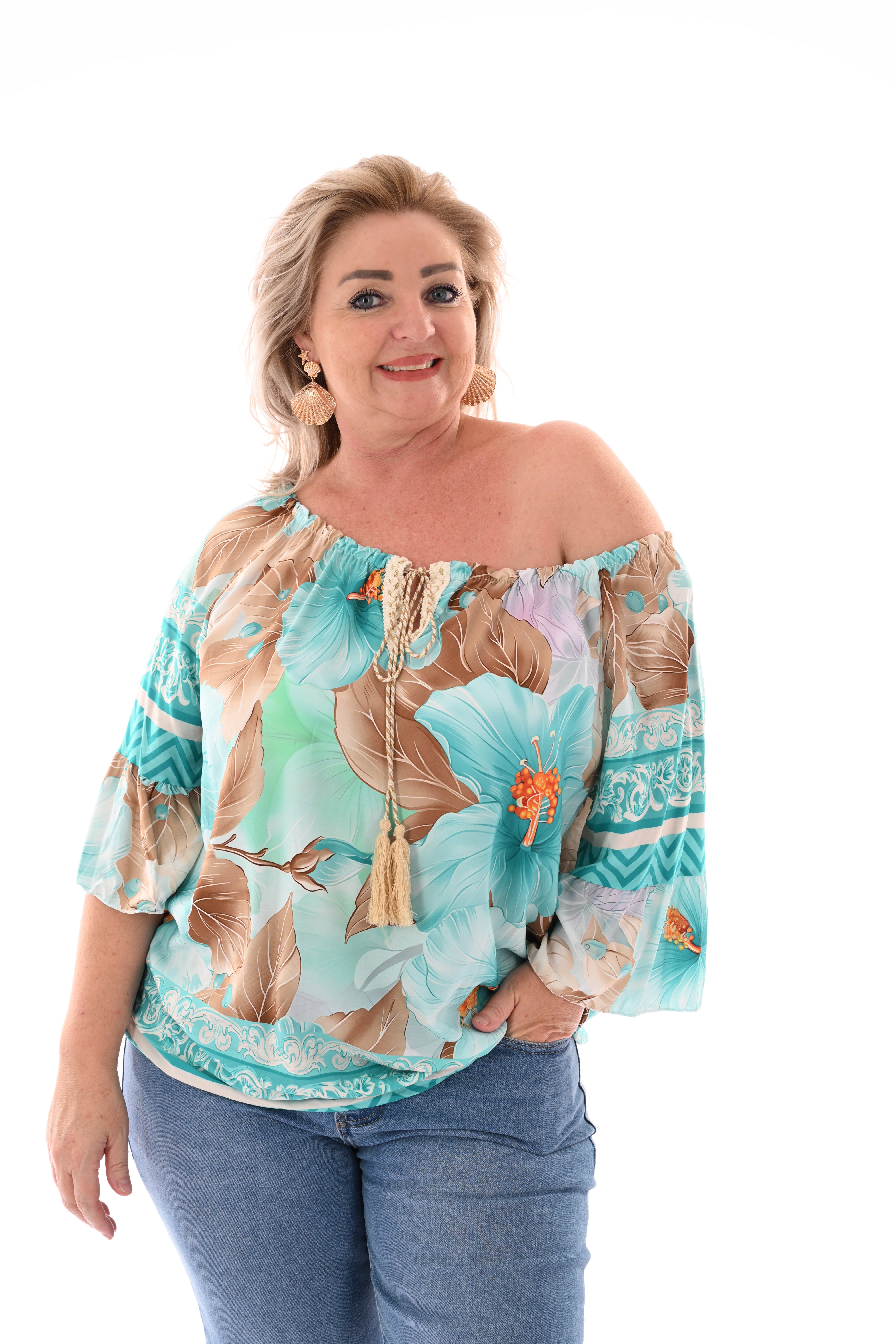 Top bloemen en trompetmouwen turqoise