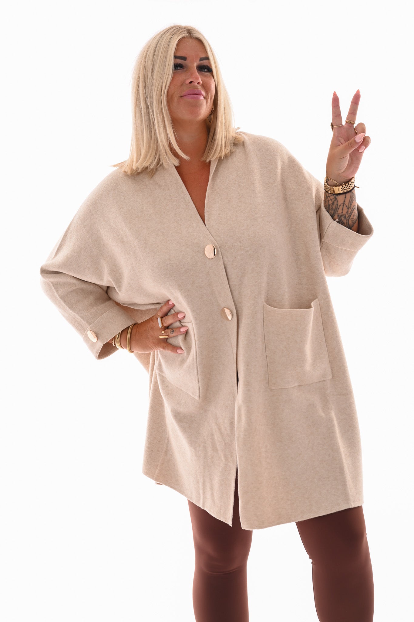 Oversized vest v-hals en grote knopen roomwit