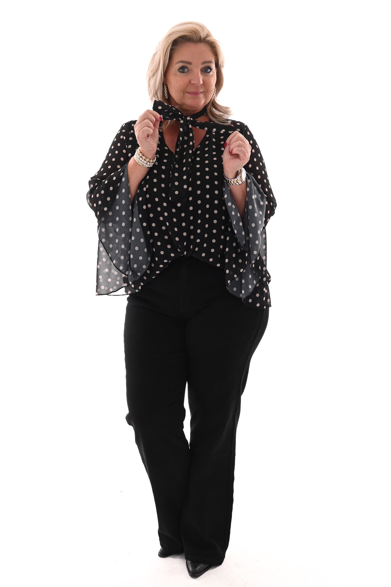 Top dots met strik en trompetmouwen zwart