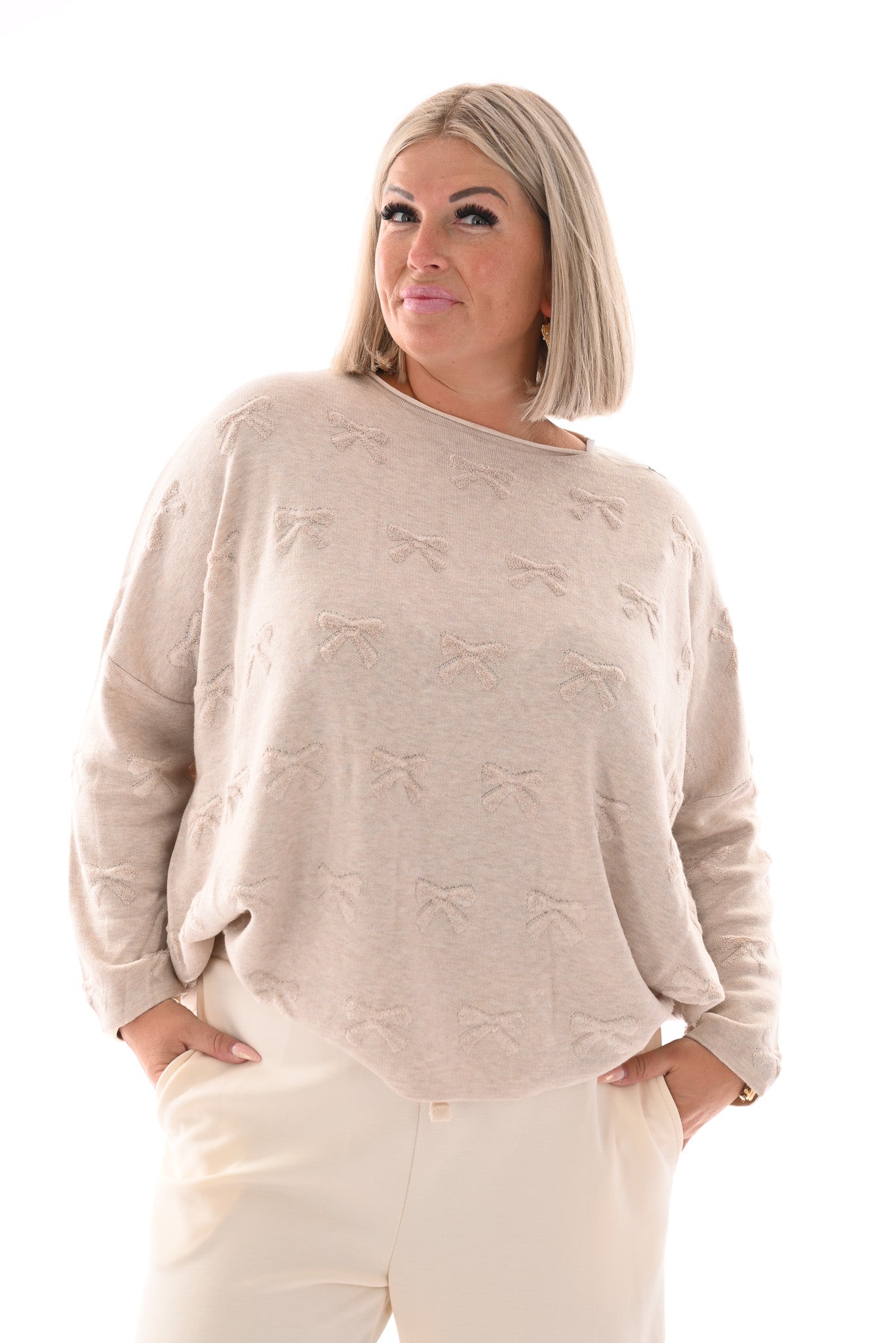 Trui strikjes beige