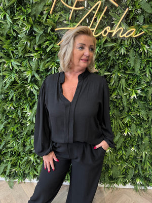Blouse roezel met pofmouwen zwart