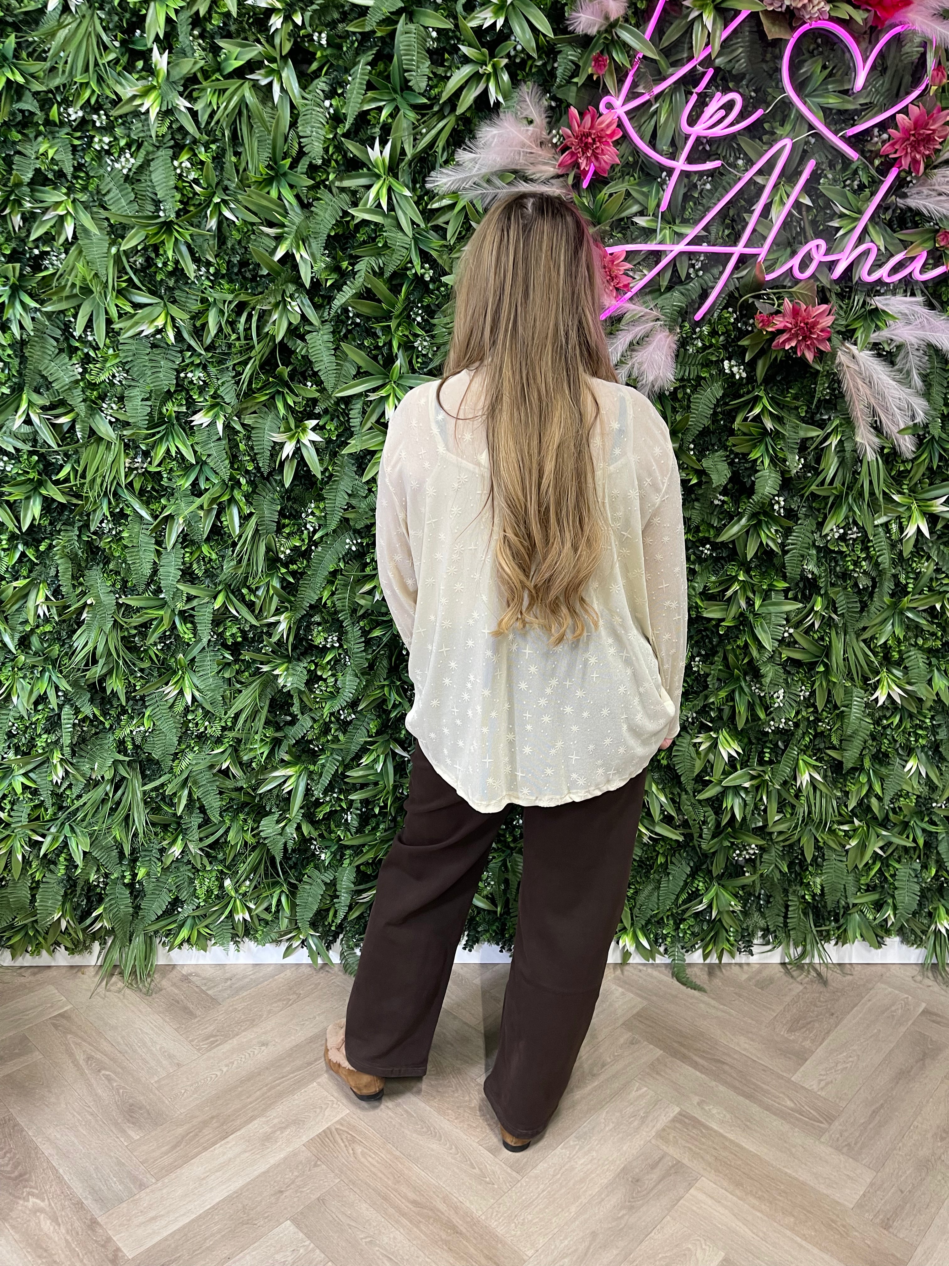 Top lurex met strik creme