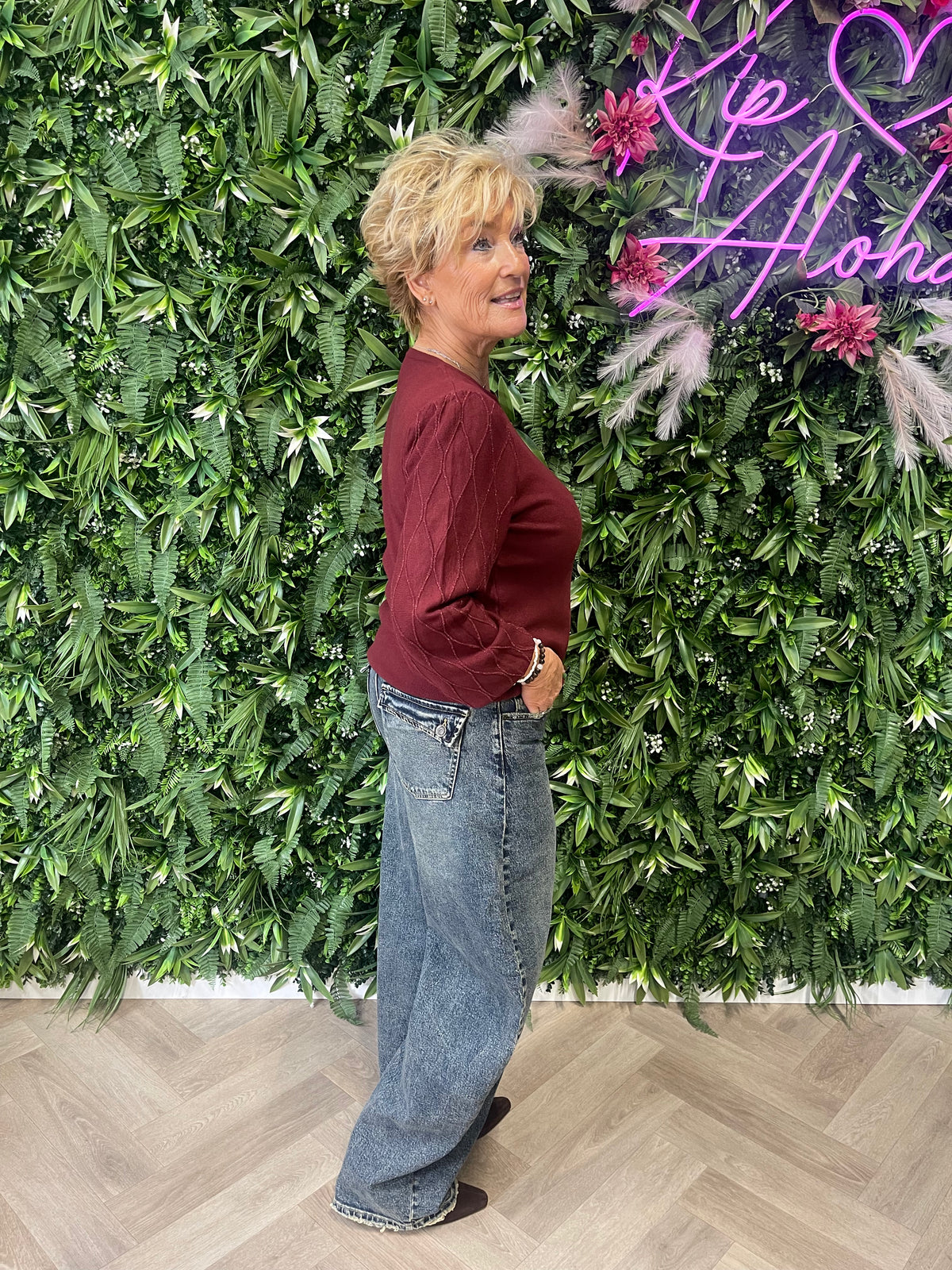Gebreide trui met lurex detail op de mouwen bordeaux