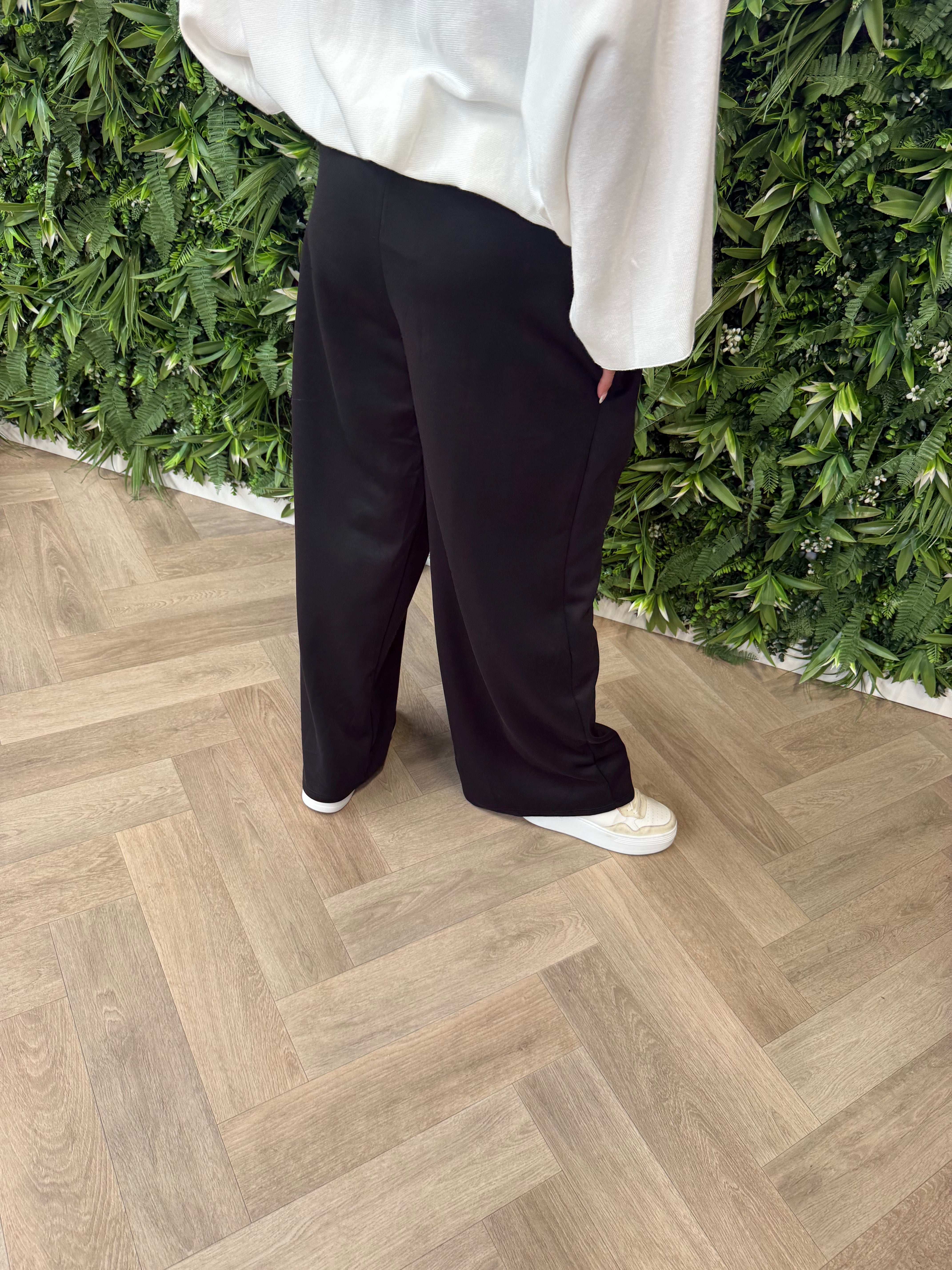 Wijde broek met streep zwart