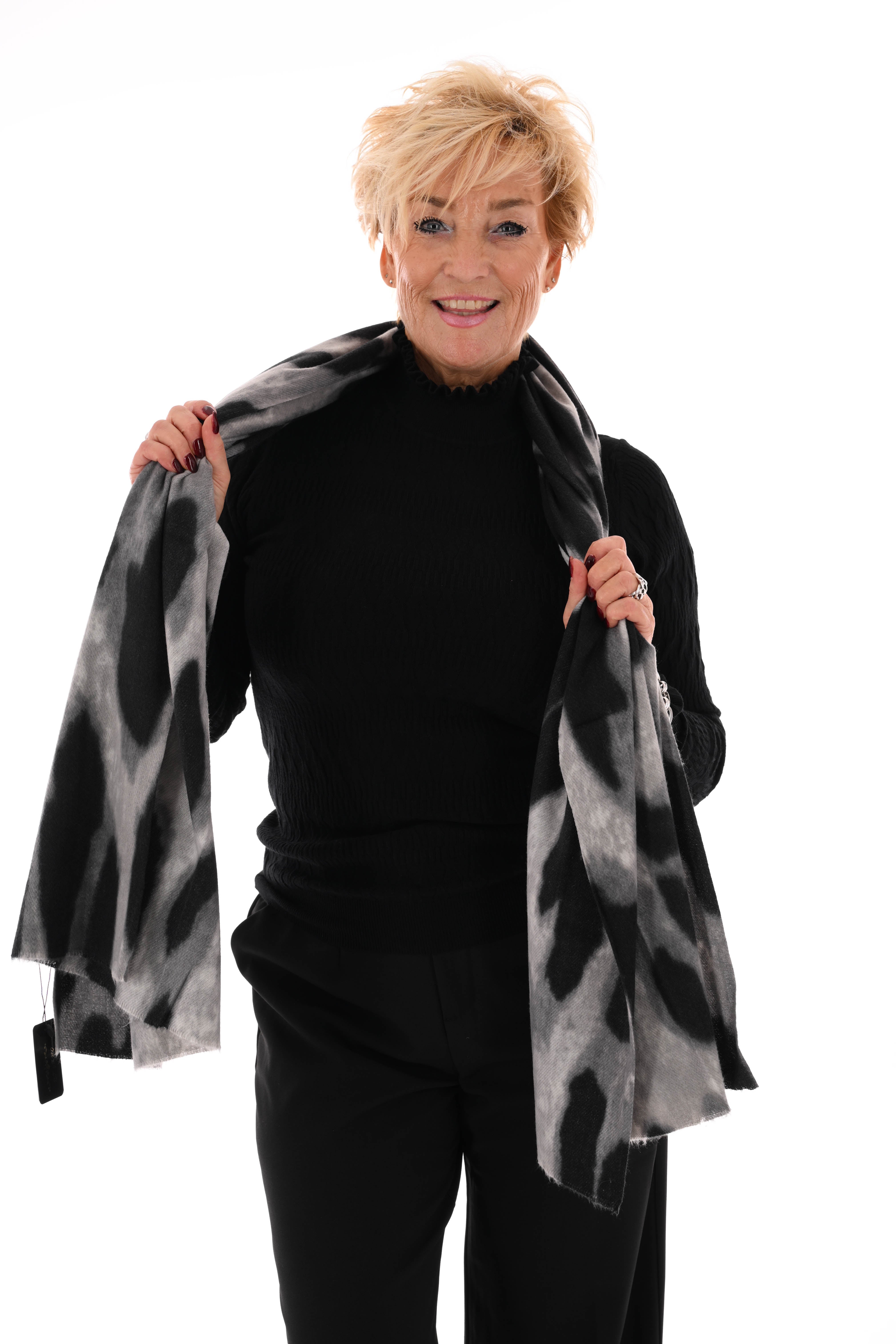 Top structuur met roezelkraag zwart