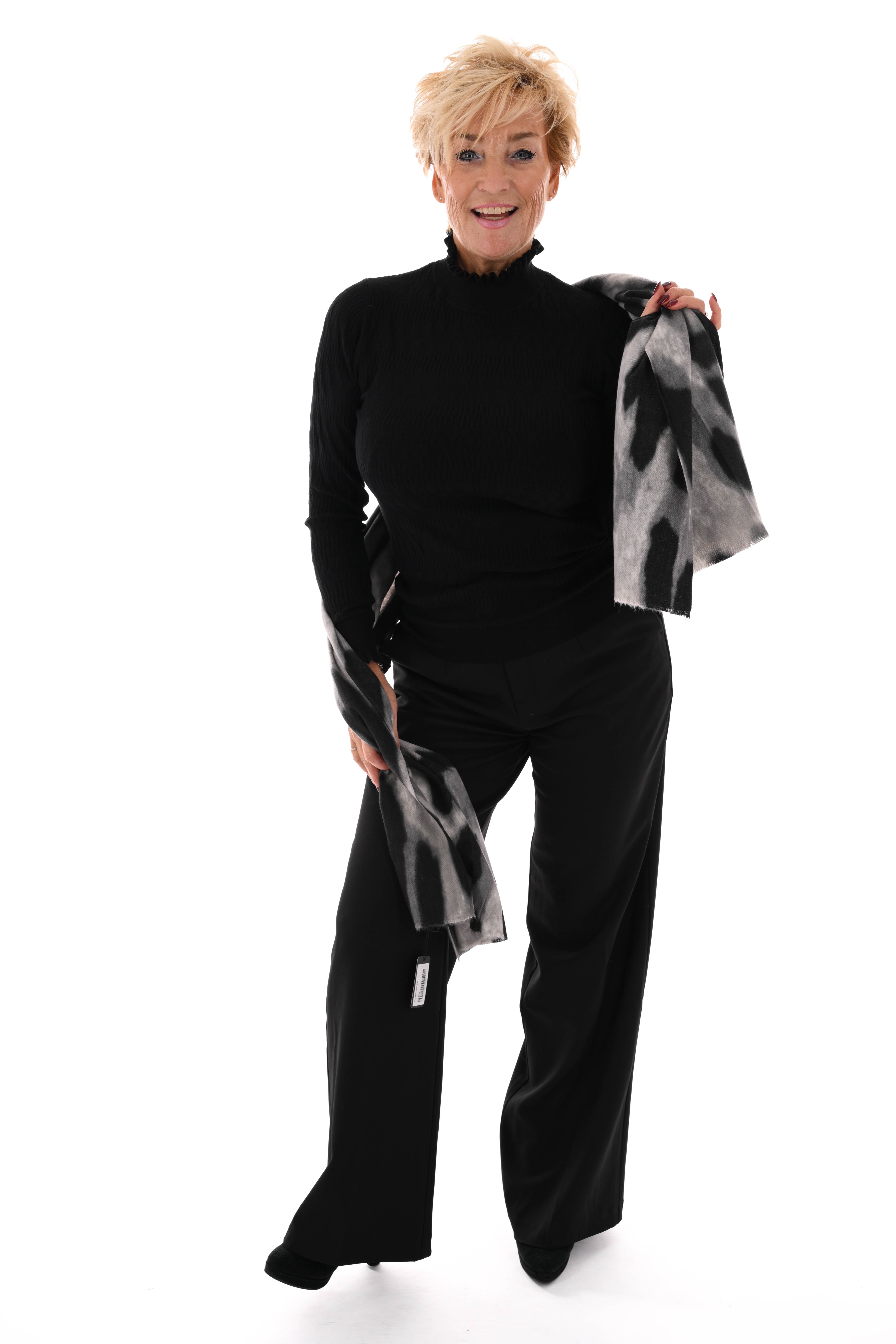 Top structuur met roezelkraag zwart